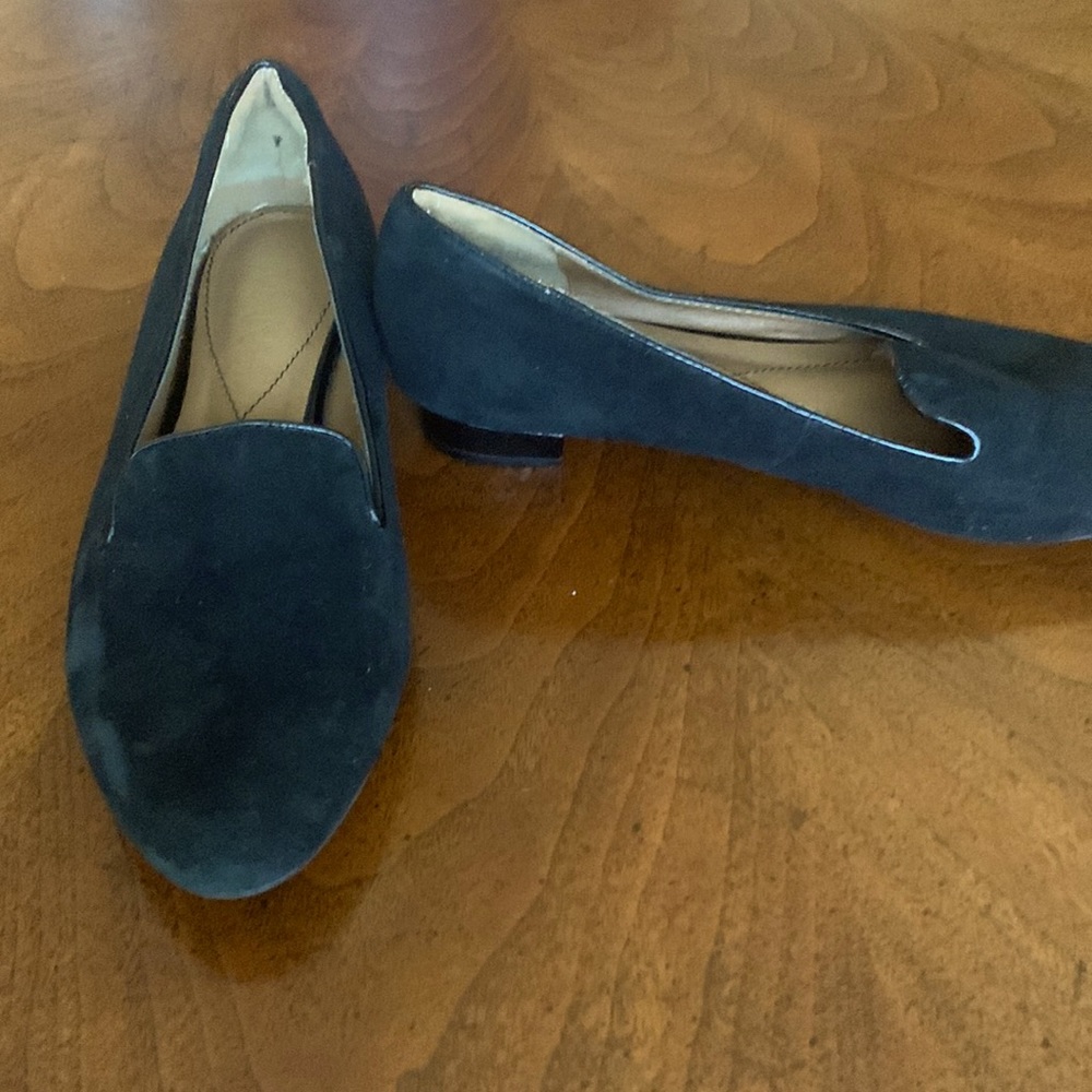 Oman. Black suede loafers with patent leather piping on heels and lips.